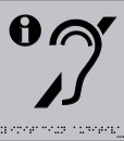 Letra I en gris metida en un crculo negro, acompaada de la silueta de una oreja cruzada con una barra en negro y fondo gris
