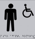 Silueta de un hombre de pie y otra en silla de ruedas en negro con fondo en aluminio blanco y braille